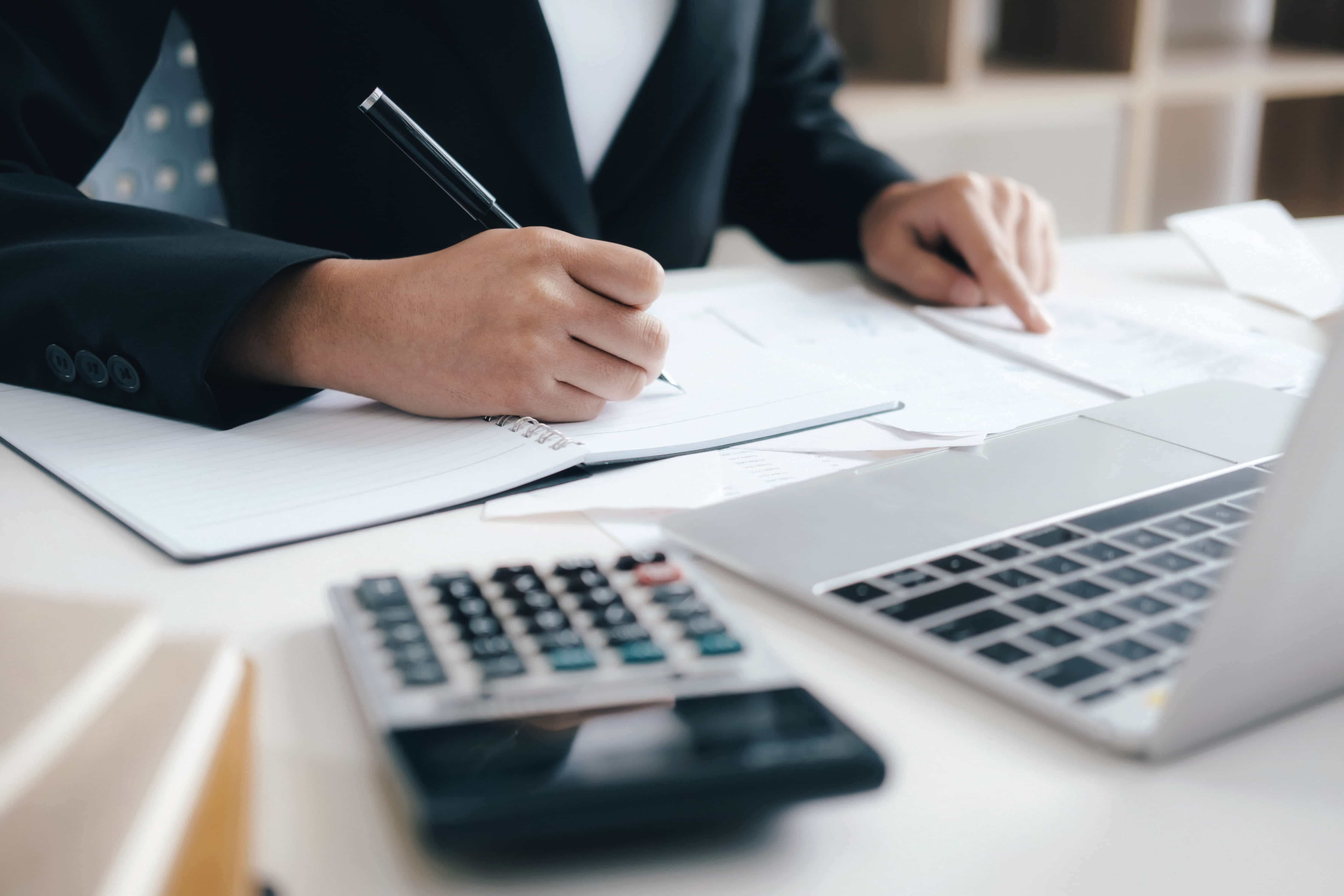 South African tax professional calculating tax returns and financial documents during tax season 2025