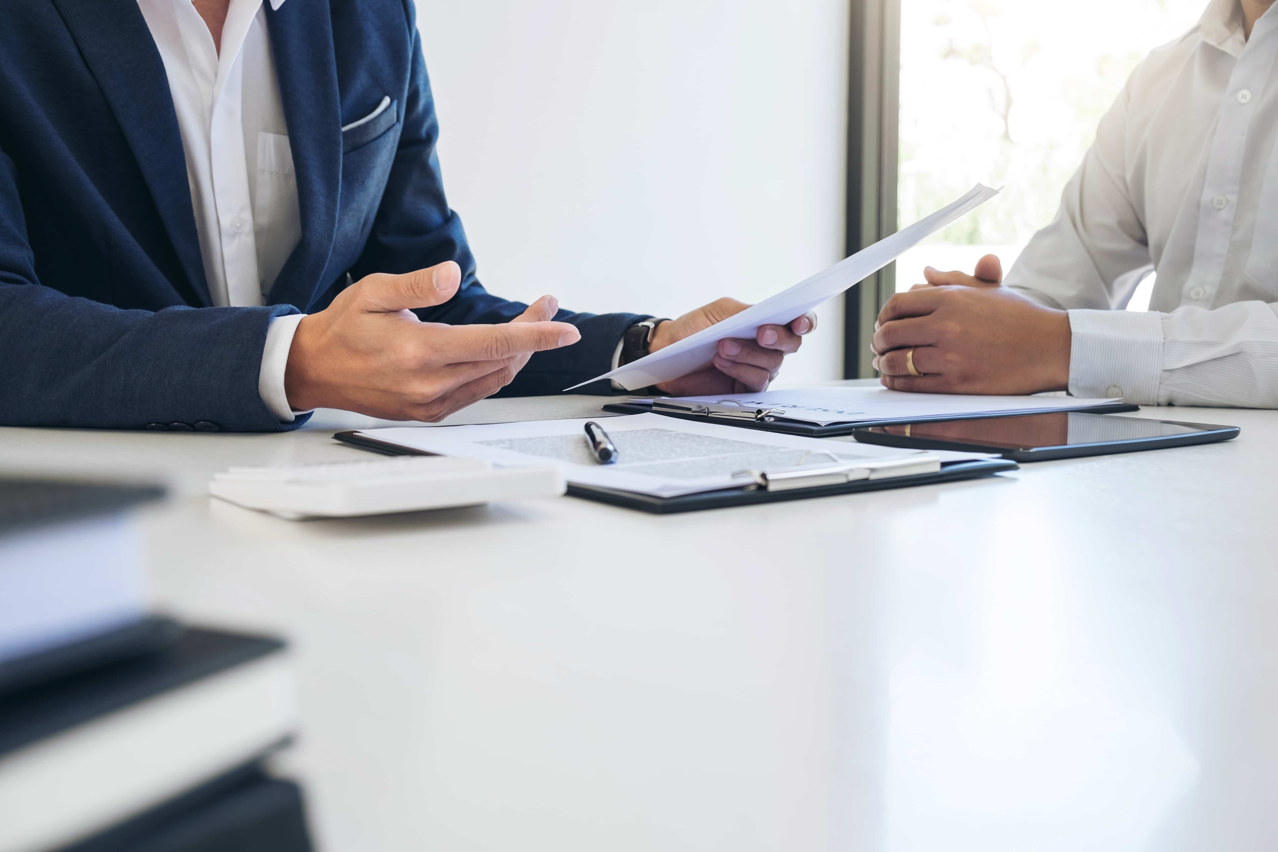 Insurance quotes consultation showing South African insurance agent presenting coverage options and policy comparisons