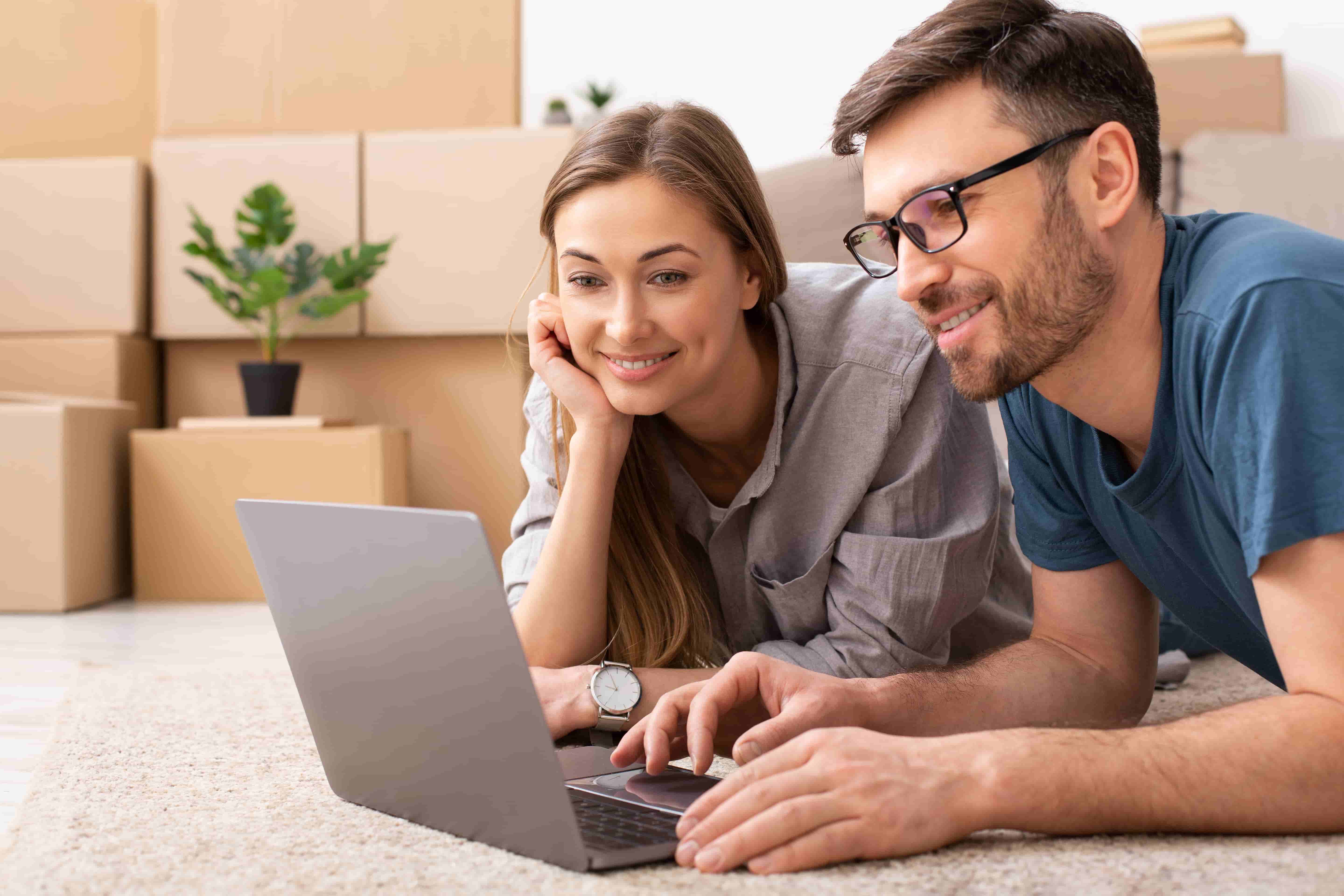Home insurance consultation showing South African couple discussing property protection and home security